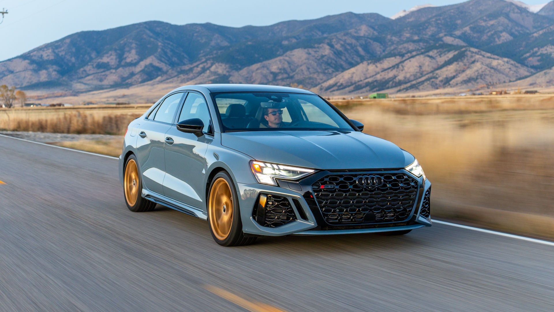 Three quarter view of an Audi vehicle accelerating.