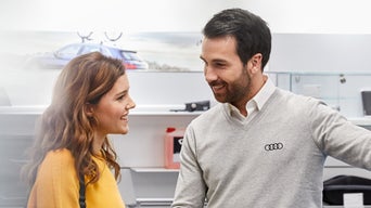 Service technician serving vehicle.