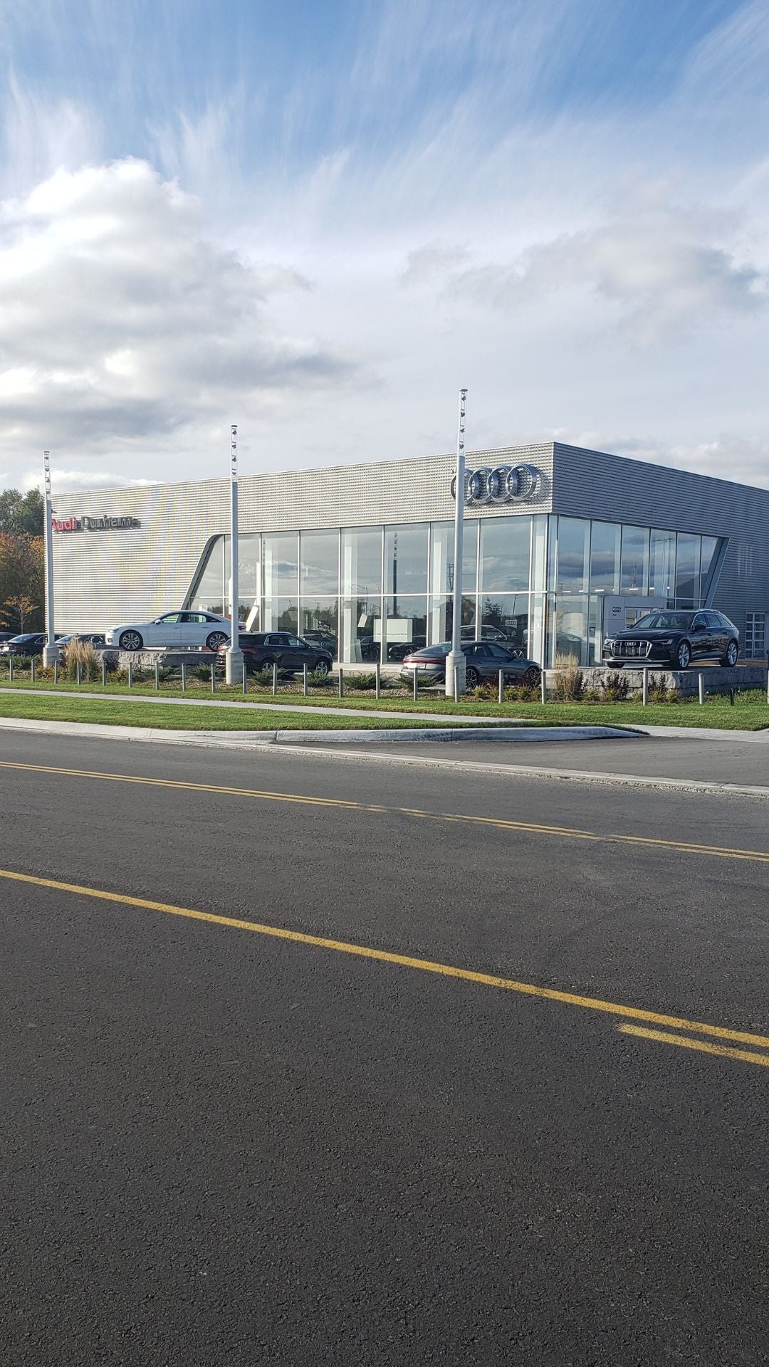 Audi 2025 Audi Q6 e-tron left profile driving.