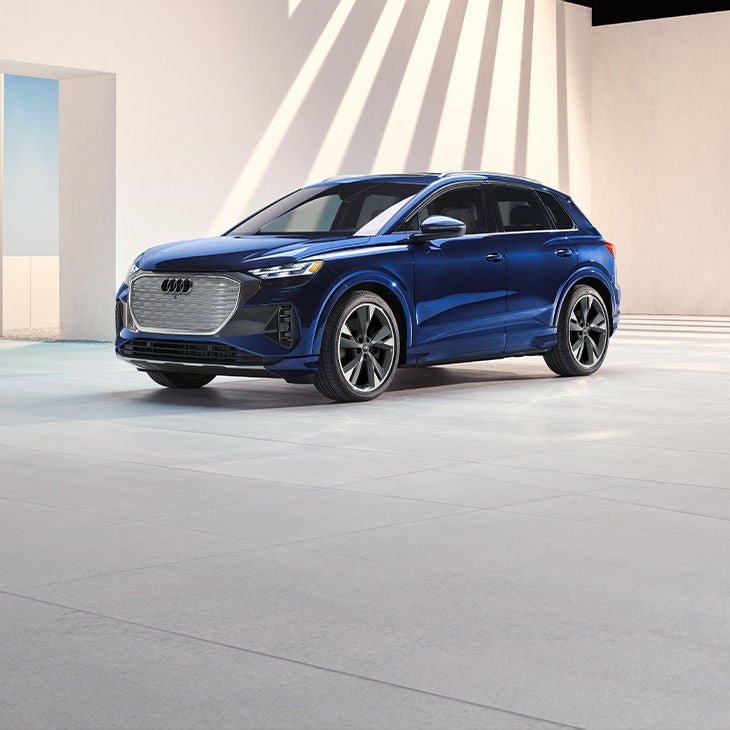 Front 3/4 profile of the Audi Q4 e-tron® parked. 