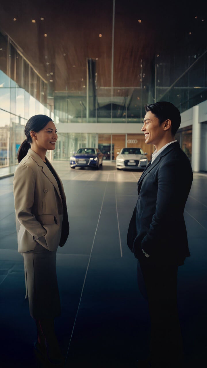 Audi Sale Specialist walking through the showroom