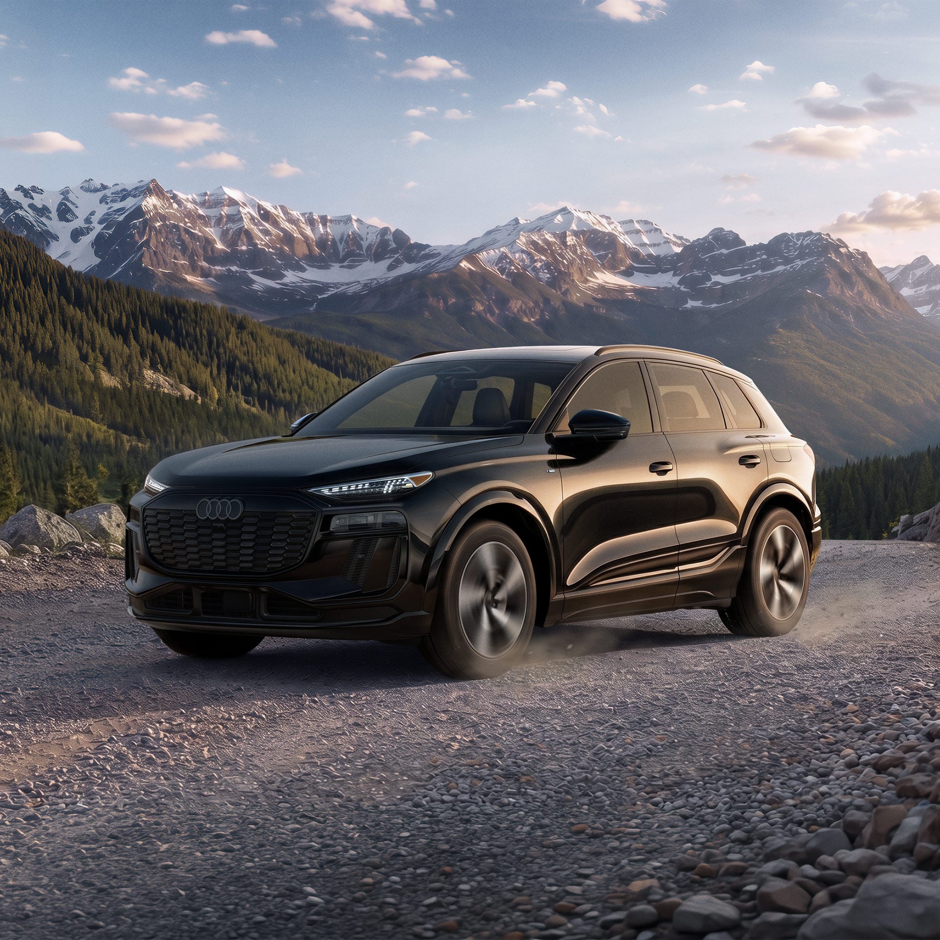 Three-quarter side profile of an Audi Q6 e-tron accelerating.