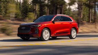 Three quarter view of an Audi Q5 accelerating.