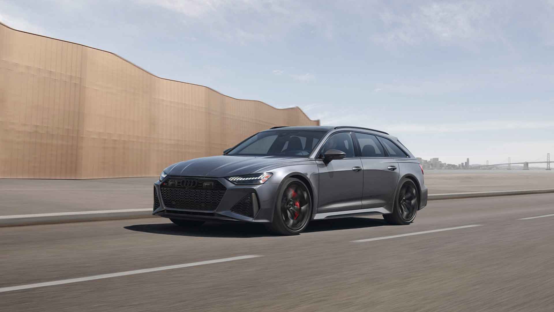 Side view of an Audi RS 6 Avant sports wagon driving.