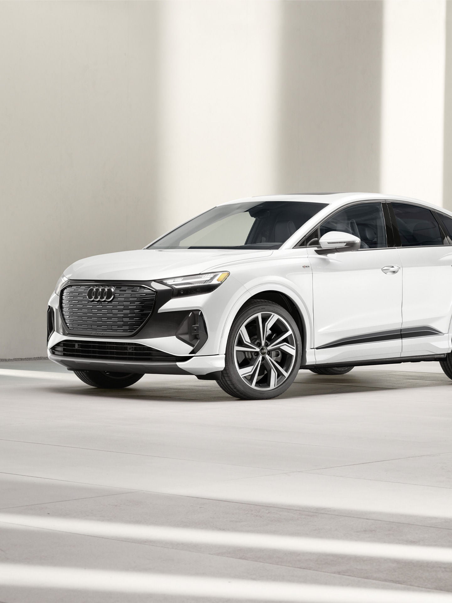 Three-quarter front view of the Audi Q4 Sportback e-tron.