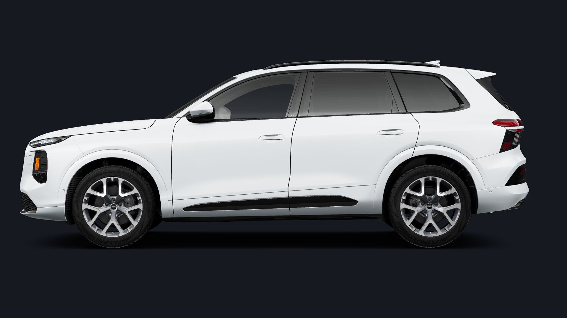 Side-view of a white Audi Q7.