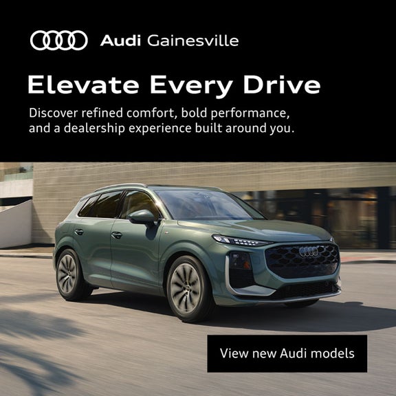 Side view of an Audi 2026 Q3 driving.