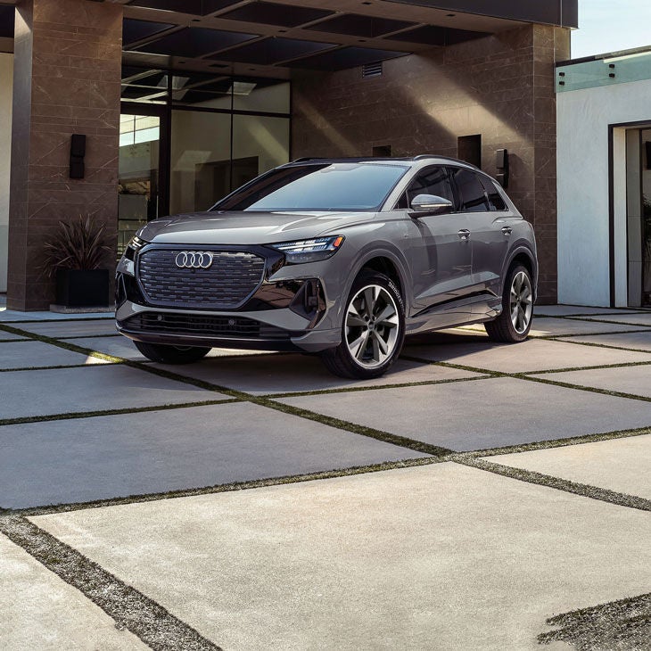 Three-quarter front view of the Audi Q4 e-tron parked.