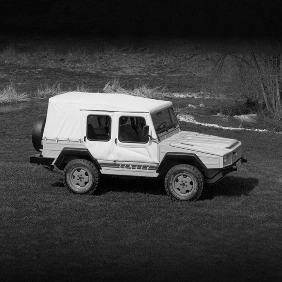 Side-view of an early Audi vehicle parked.