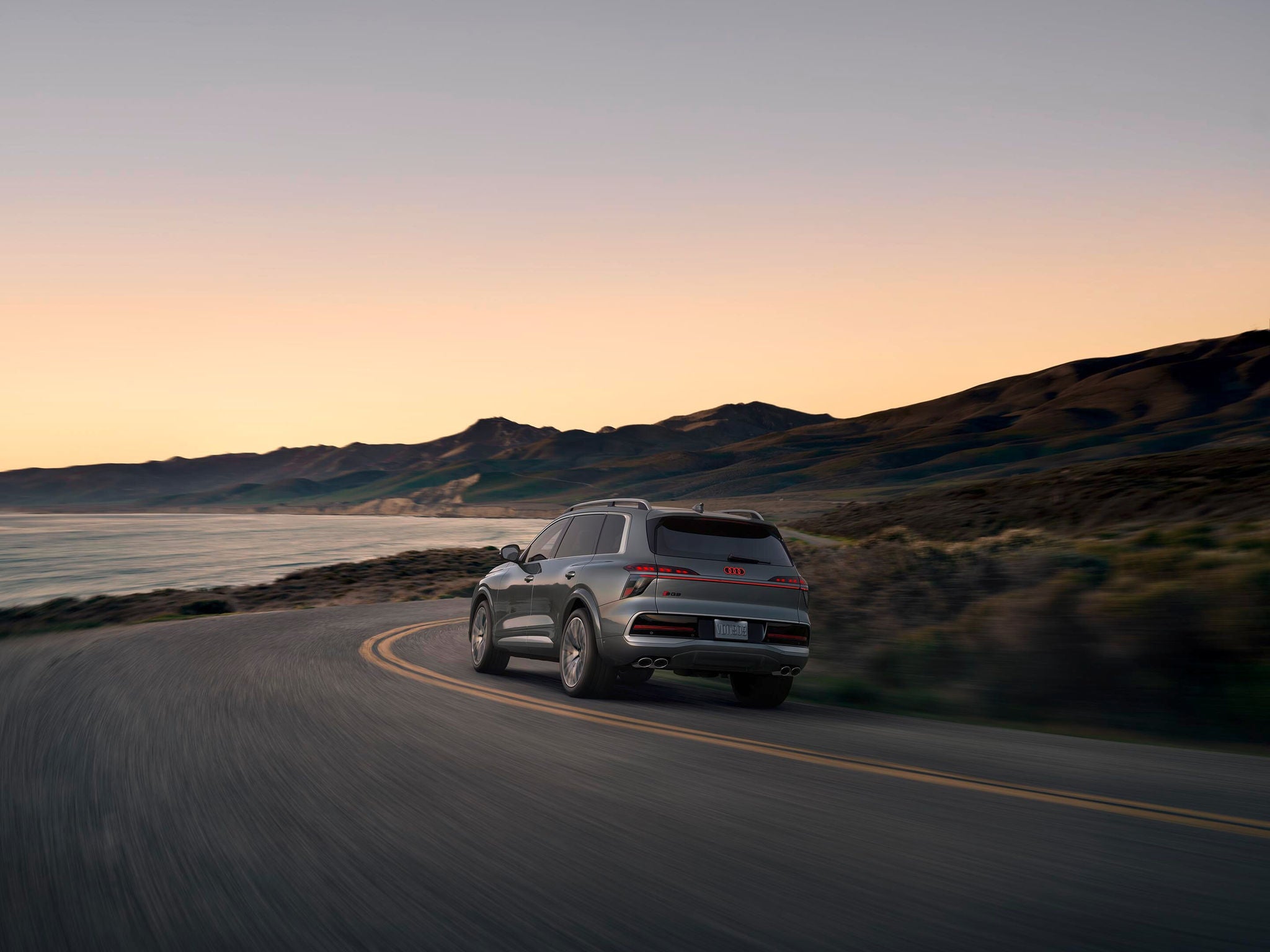 q9 driving on coastal road