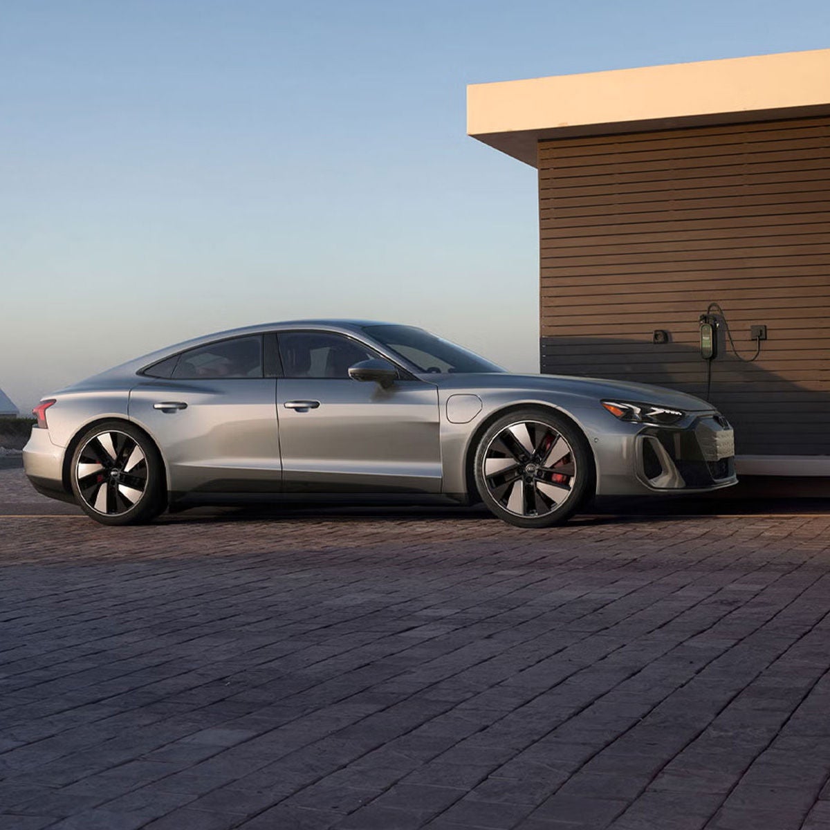 side view of Audi parked outside charging