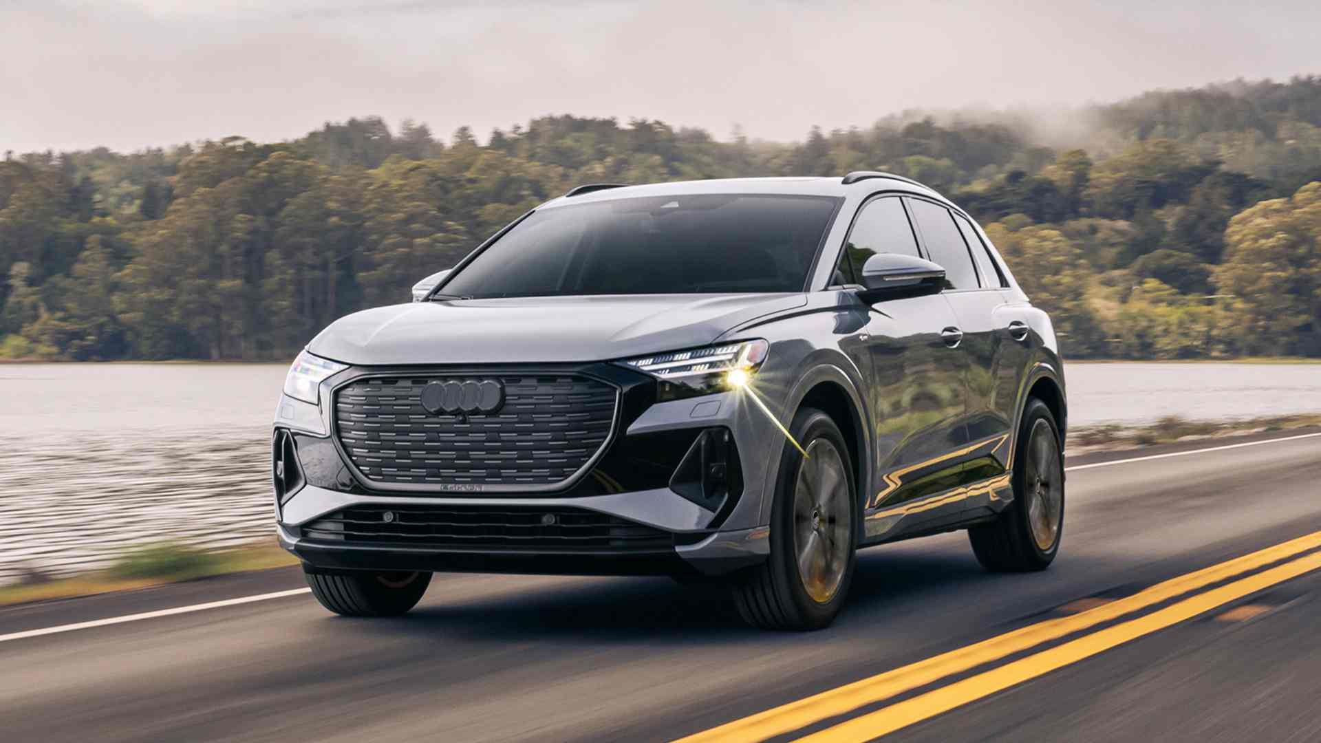 Right profile view of an Audi Q4 e-tron accelerating.