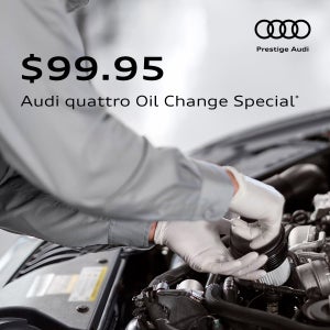Audi technician installing an oil filter