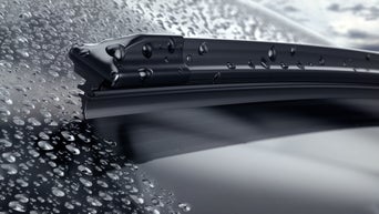 vehicle wiper blades wiping water off windshield