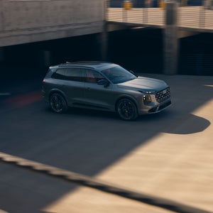 Elevated side view of the Audi SQ7 in motion.