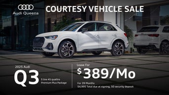 Left side profile of an Audi Q3 parked.