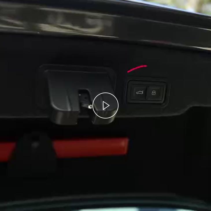 A close-up photo inside an Audi vehicle showing the hands-free tailgate display light.