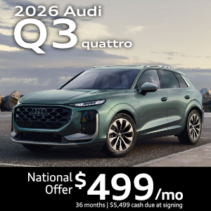 Side view of an Audi Q3 driving.