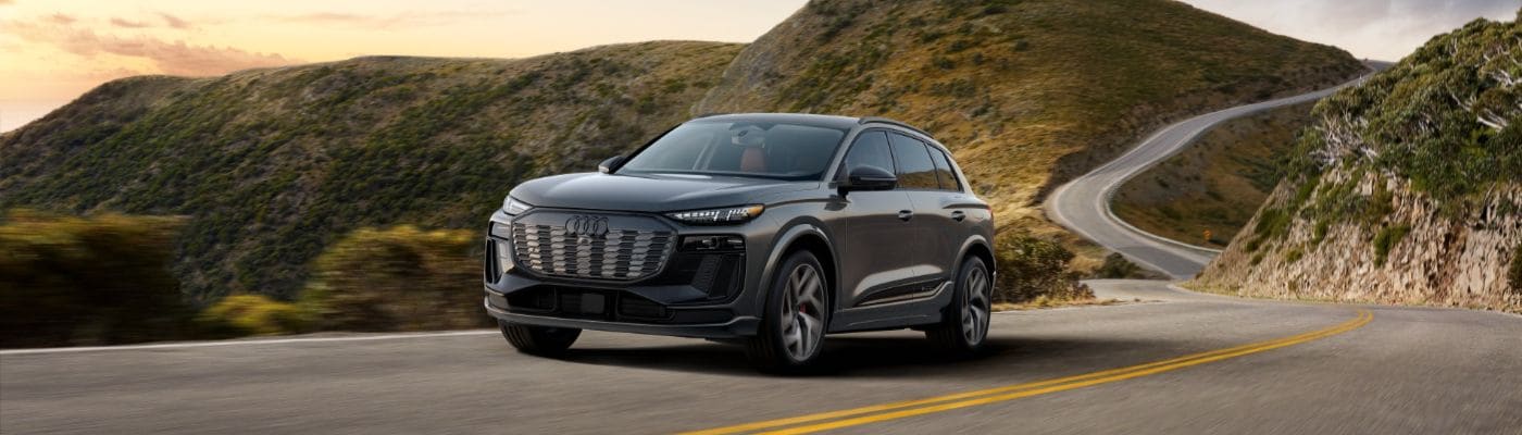 Front view of 2025 Audi SQ6 e‑tron in scenic mountain setting