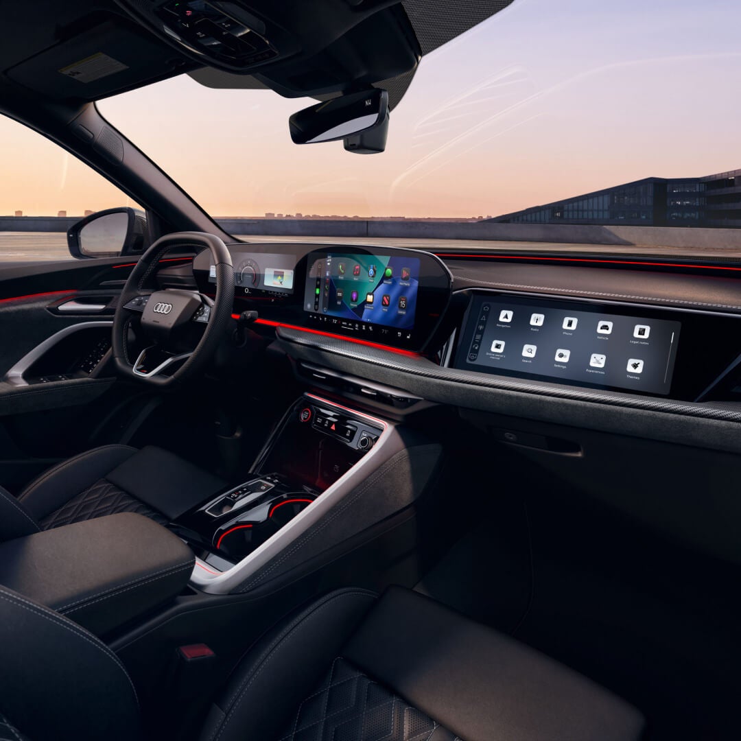 Interior view of the front dashboard of 2026 Audi SQ5 in black.