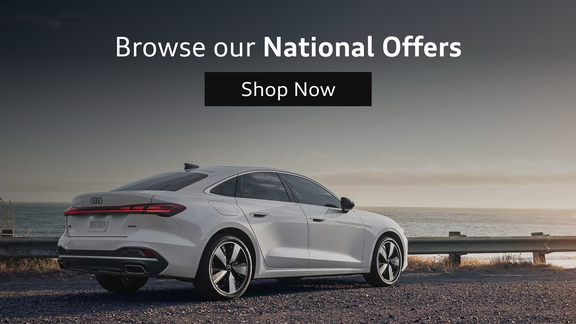 Three-quarter side profile of an Audi RS e-tron GT accelerating.