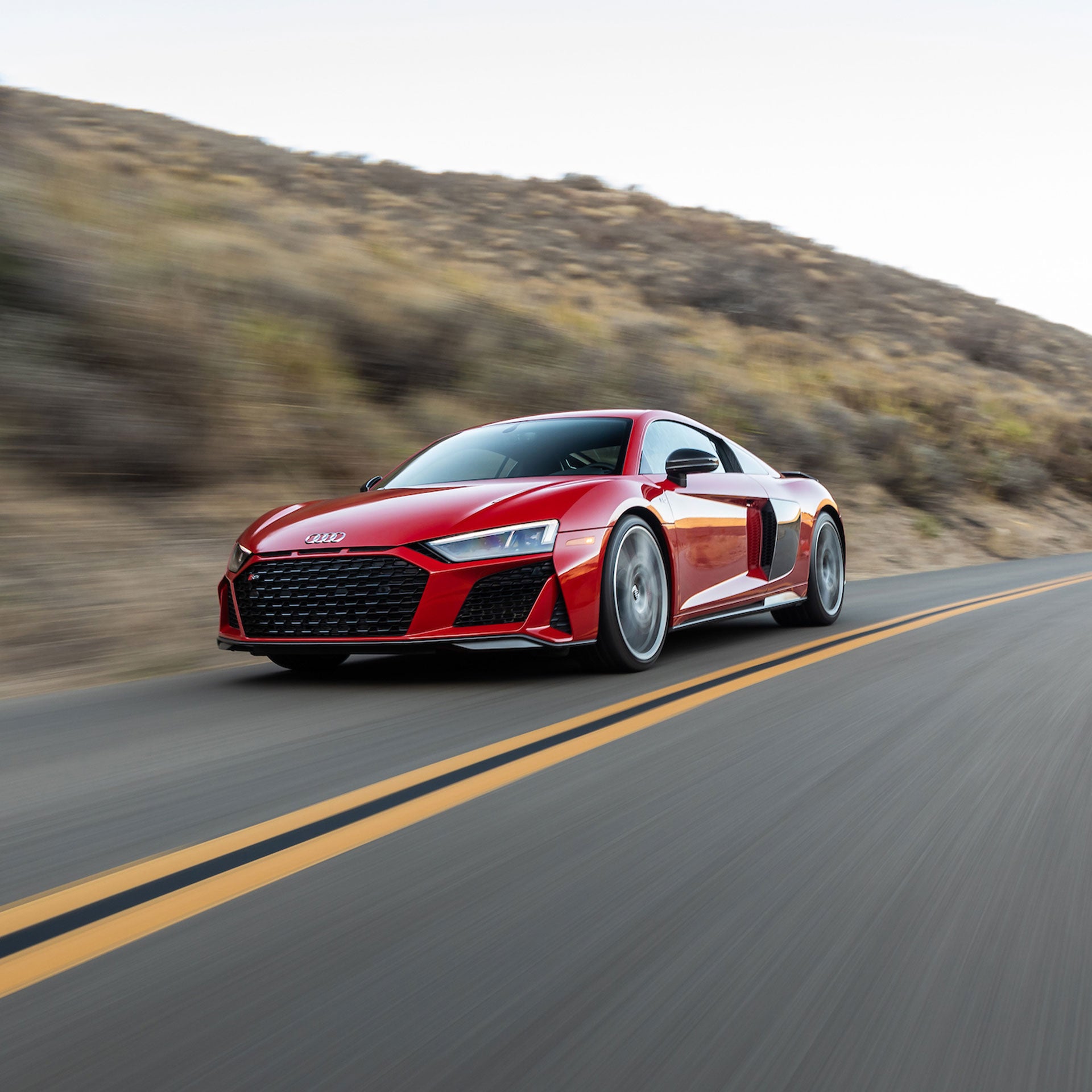 A highway with various vehicles wrapped in blue scan lines.