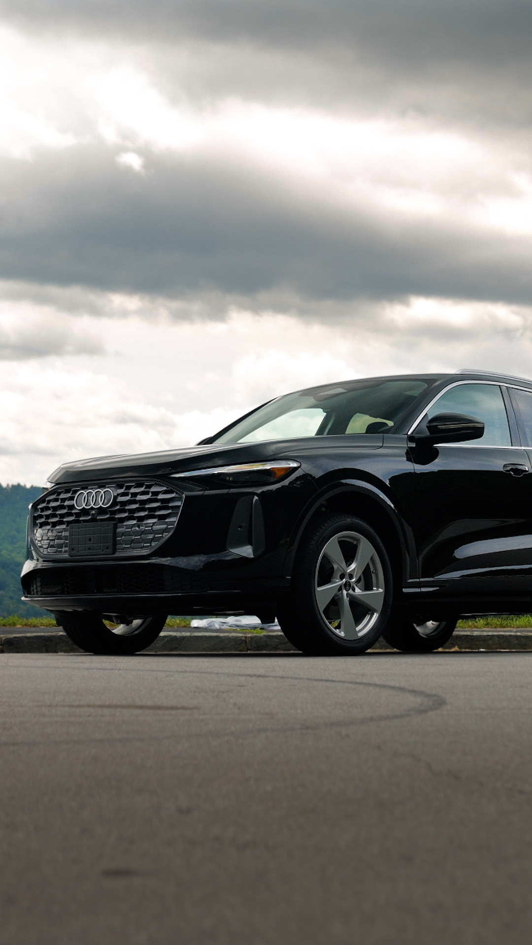 Side view of an Audi vehicle parked.