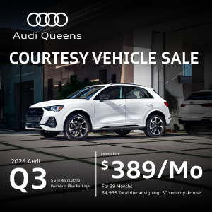 Side left profile view of an Audi Q3 parked.