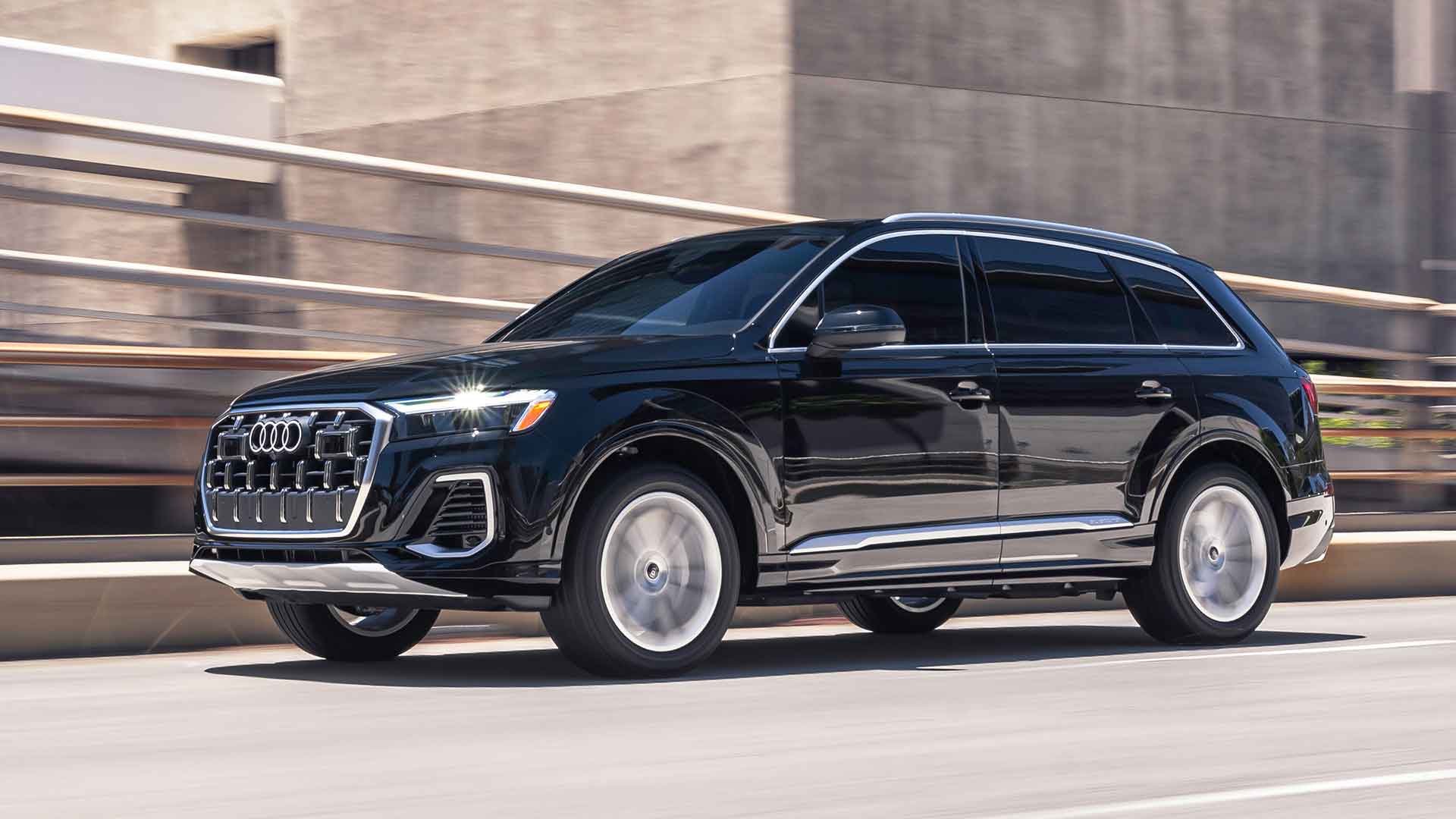 Side view of an Audi vehicle driving