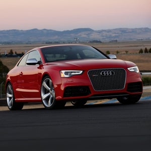 Elevated front-view of the Audi RS 5 Coupe parked.