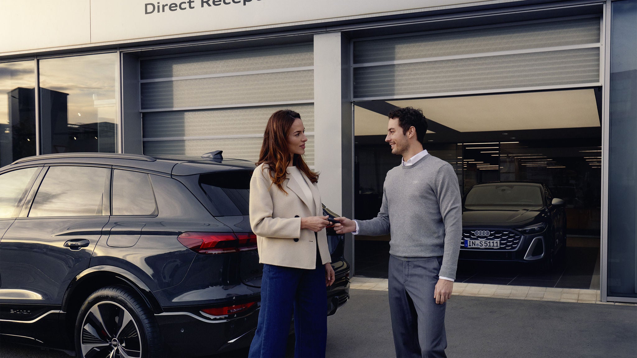 Audi service technician servicing a vehicle.