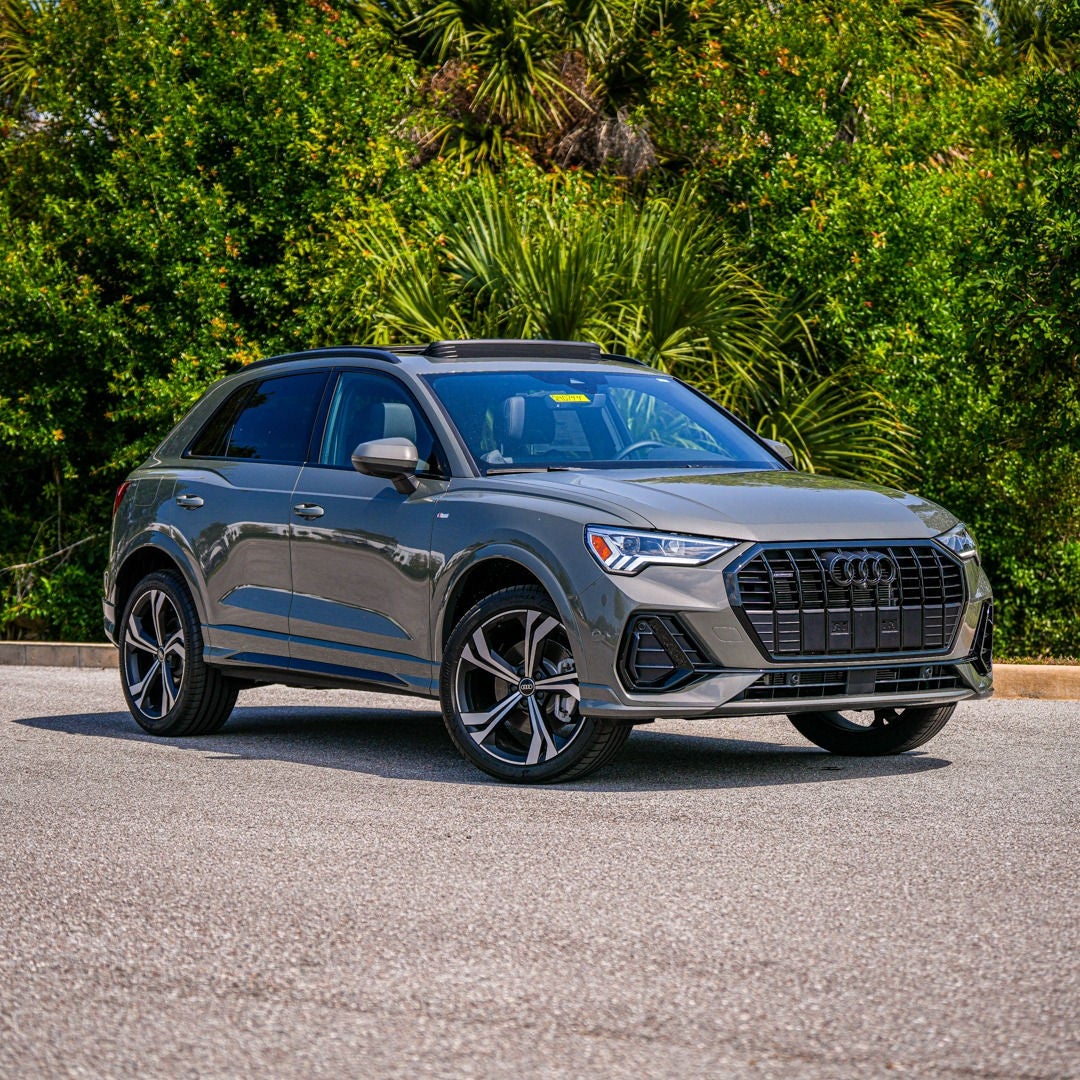 Side profile view of an Audi vehicle.