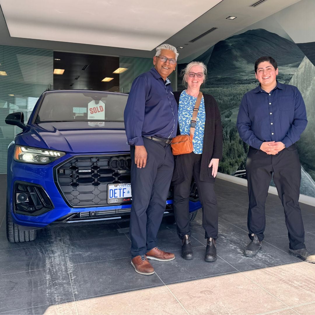 Image of an Audi being delivered to customers