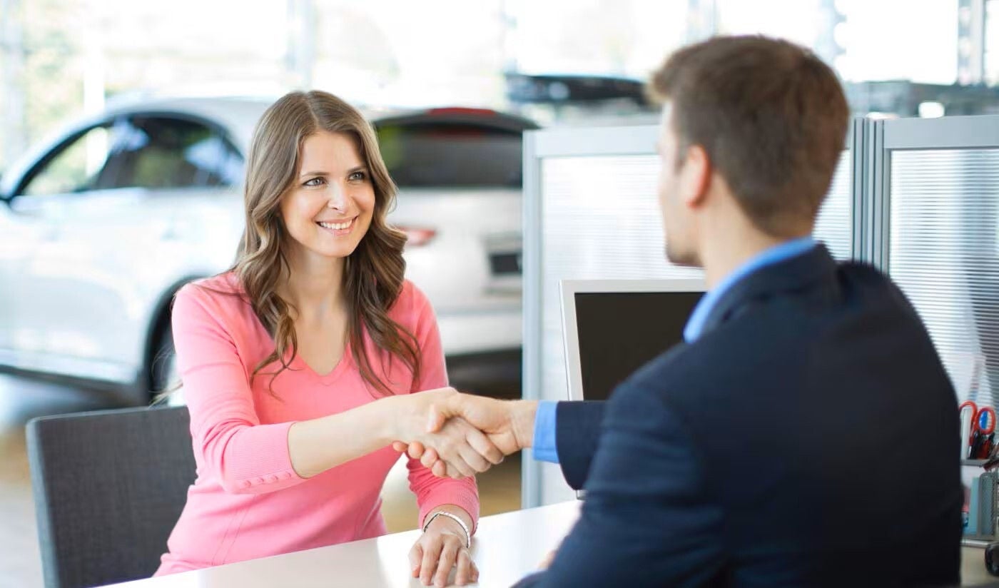 Audi employee greeting customer. 