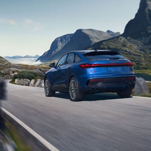 Rear 3/4 view of the Audi SQ5 Sportback in motion.