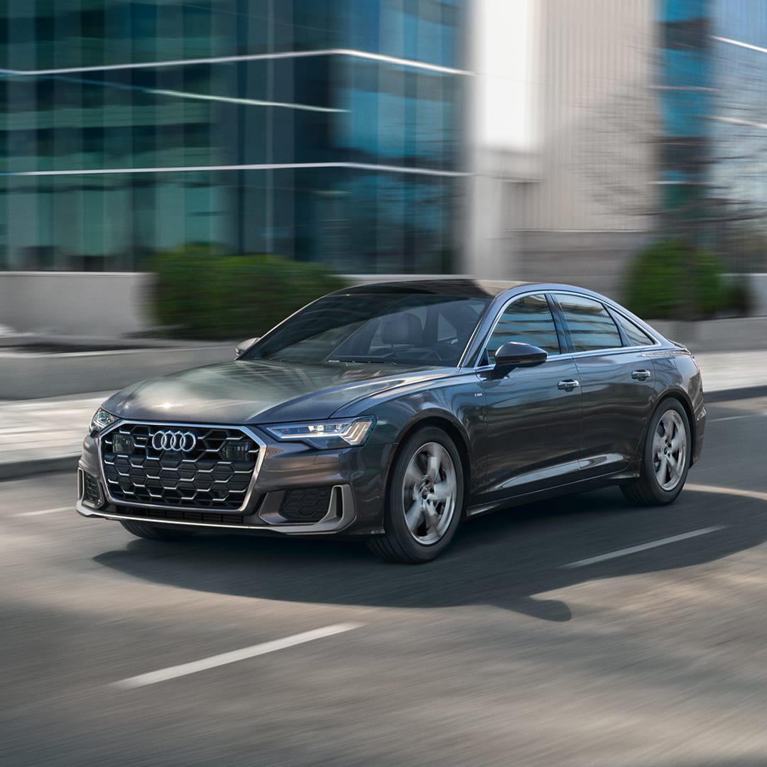 Left profile view of an Audi A6 accelerating.