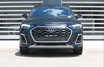 Audi loaner in front of building