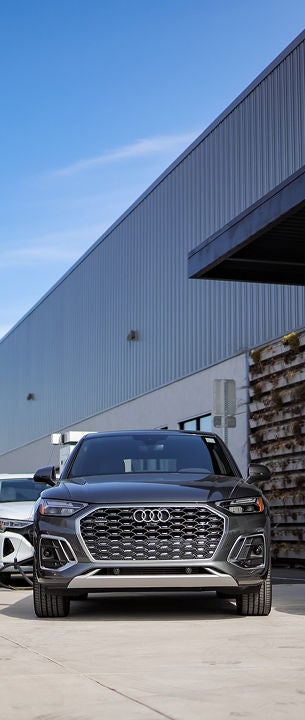 Audi 2025 Audi Q6 e-tron left profile driving.