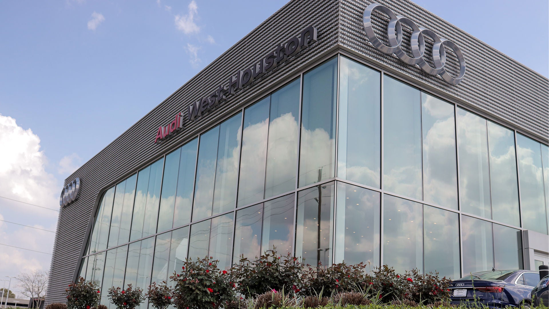 Exterior view of the Audi West Houston dealership.