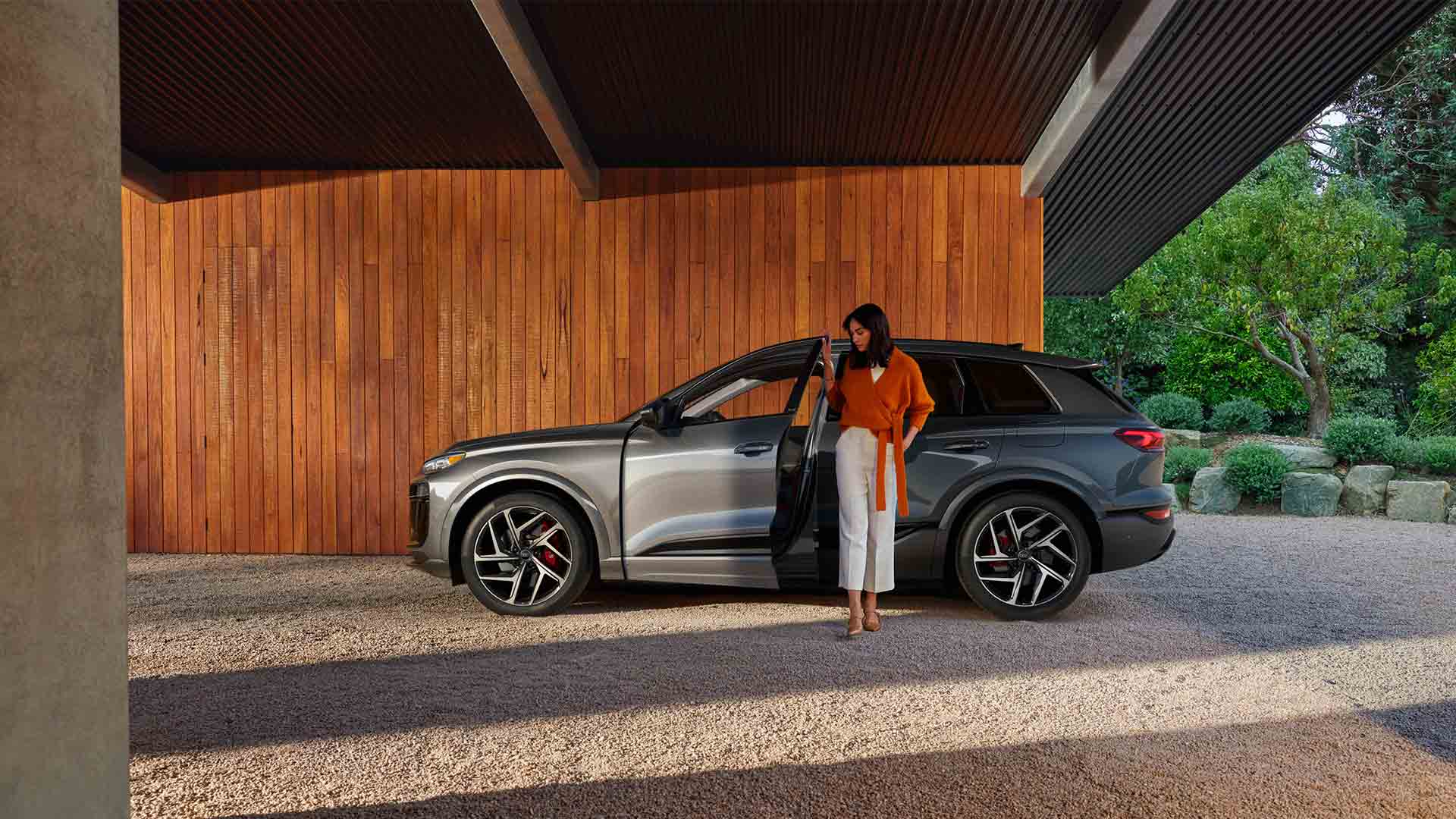 Side angle of an Audi SQ6 e-tron parked.