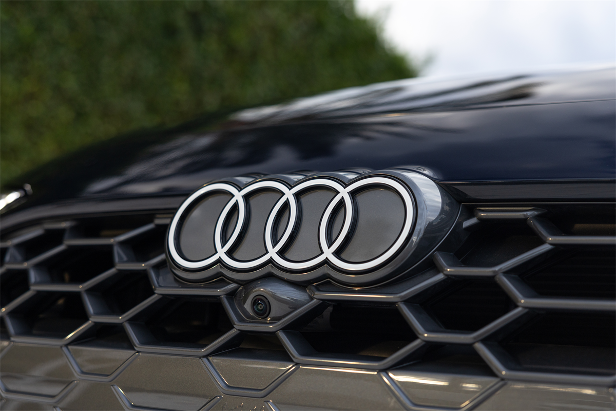 The Audi logo on the grille of a car