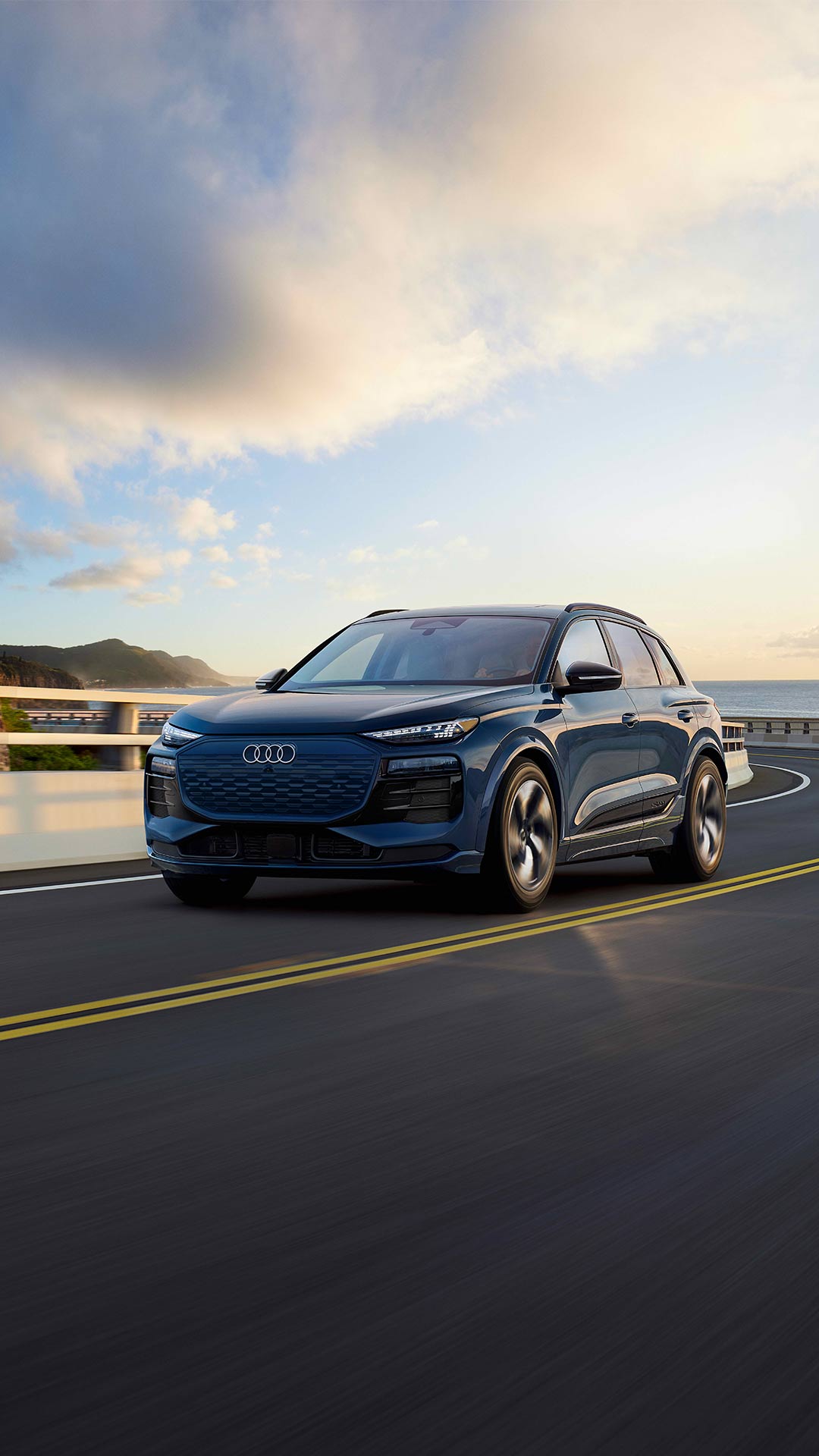 Profile view of an Audi Q6 accelerating.