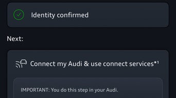 Interior view of a man driving an Audi.