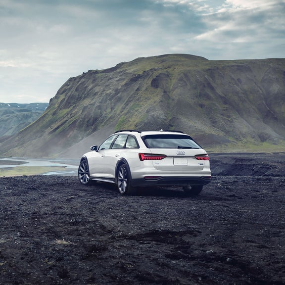 Three-quarter front view of the Audi A6 allroad accelerating.