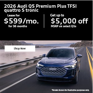 Side view of an Audi Q5 driving.