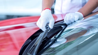 Service Tech Insalling Windshield Wipers