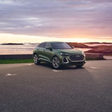 Audi Q5 Parked with sunset behind it.