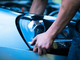 Service technician servicing tire.