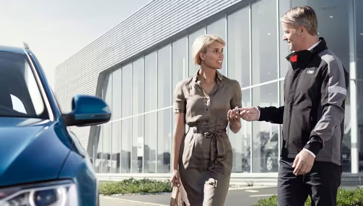 Right side profile view of an Audi Q8 SUV parked.