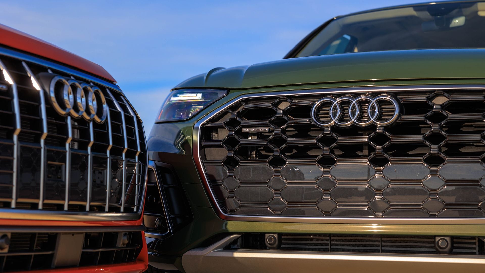 Three quarter view of an Audi vehicle parked.